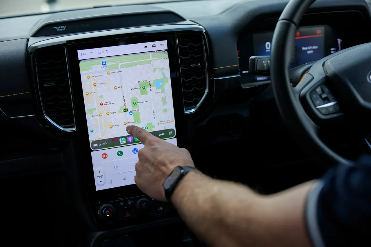 An iPhone being used for navigation inside a Tonkin vehicle
